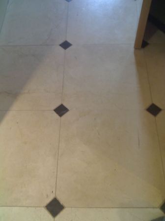 Crema Marfil polished Marble floor before renovation by Tile Doctor